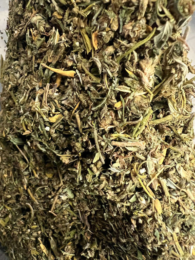 Close-up of finely trimmed Delta 8 Sour Lifter cannabis shake showcasing rich green hues.