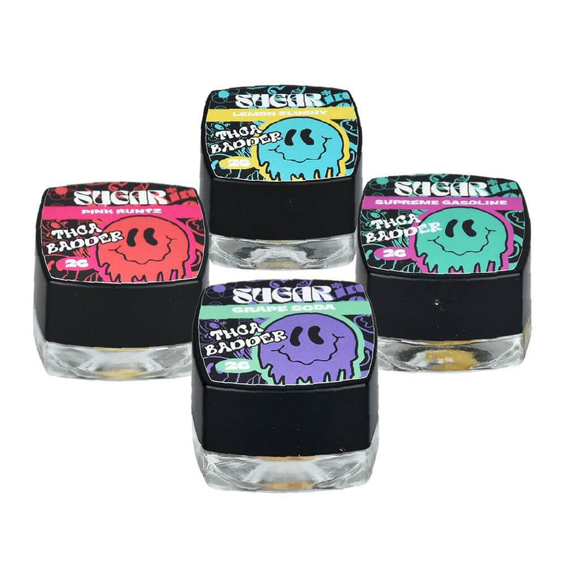 Four colorful containers of Sugar THCA Badder, showcasing different flavors and high-quality cannabis extract.