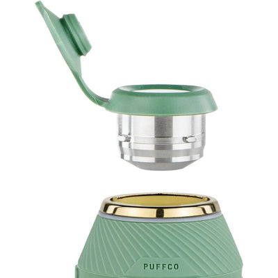 Close-up of the Puffco Proxy Vaporizer Flourish LE, showing the green and silver modular top part, highlighting its design and functionality.