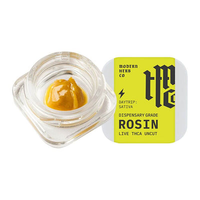 Modern Herb Co Dispensary Grade Live Rosin THCA uncut dabs in a glass jar with bright packaging.