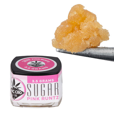 WNC CBD THCA Sugar product container and THCA sugar for enhancing smoking experiences.