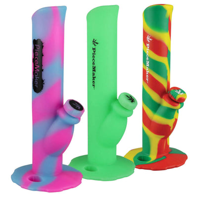 PieceMaker Kermit Silicone Bong in three colors: Glowing Kotton Kandy, glowing green, and Rasta Swirl, featuring an integrated lighter holder.