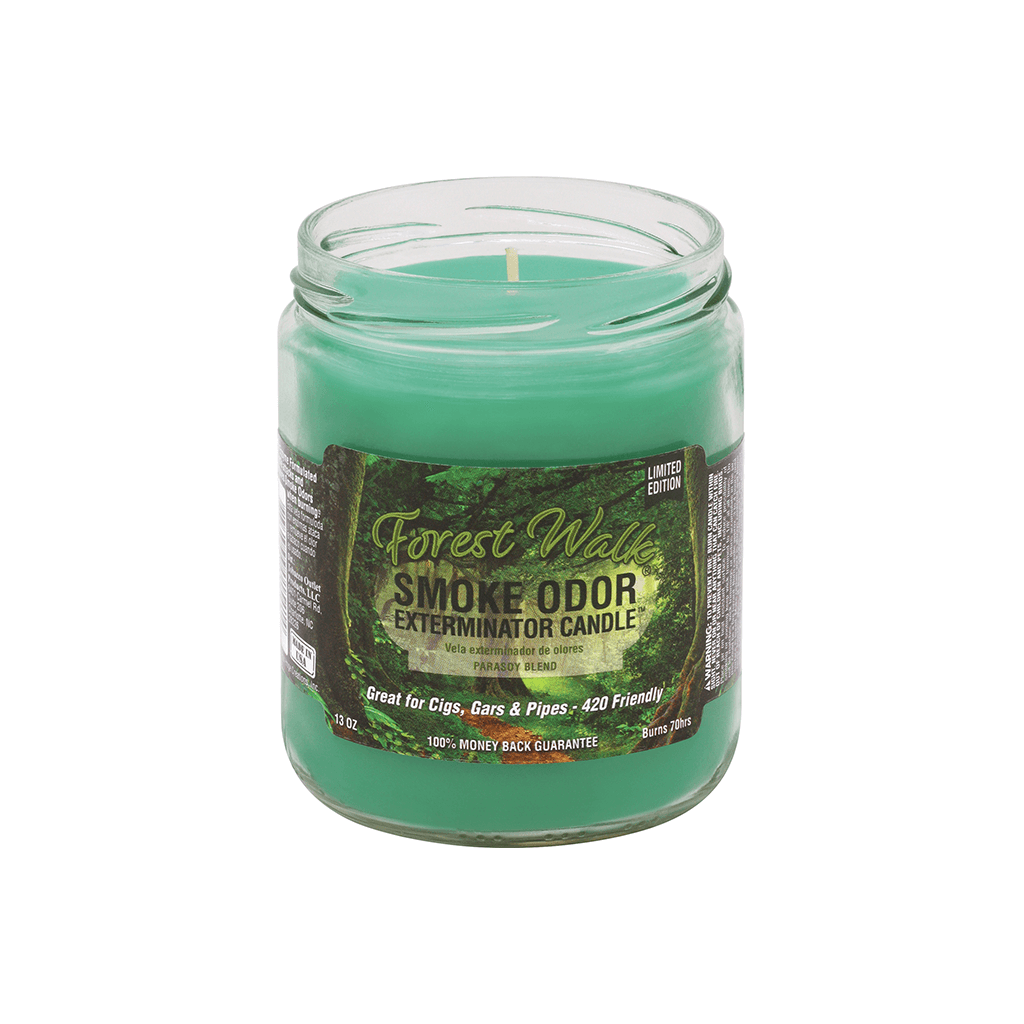 Forest Walk Smoke Odor Exterminator Candle in a glass jar, designed to neutralize smoke odors from cigars and pipes.