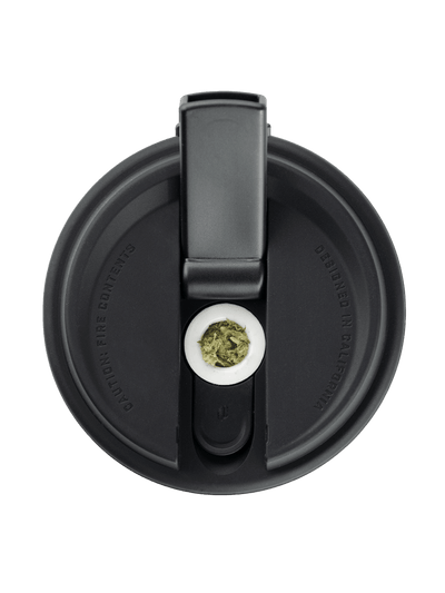 Top view of Puffco Cupsy coffee cup water pipe with hidden bowl storage, showcasing its discreet design and black silicone lid.