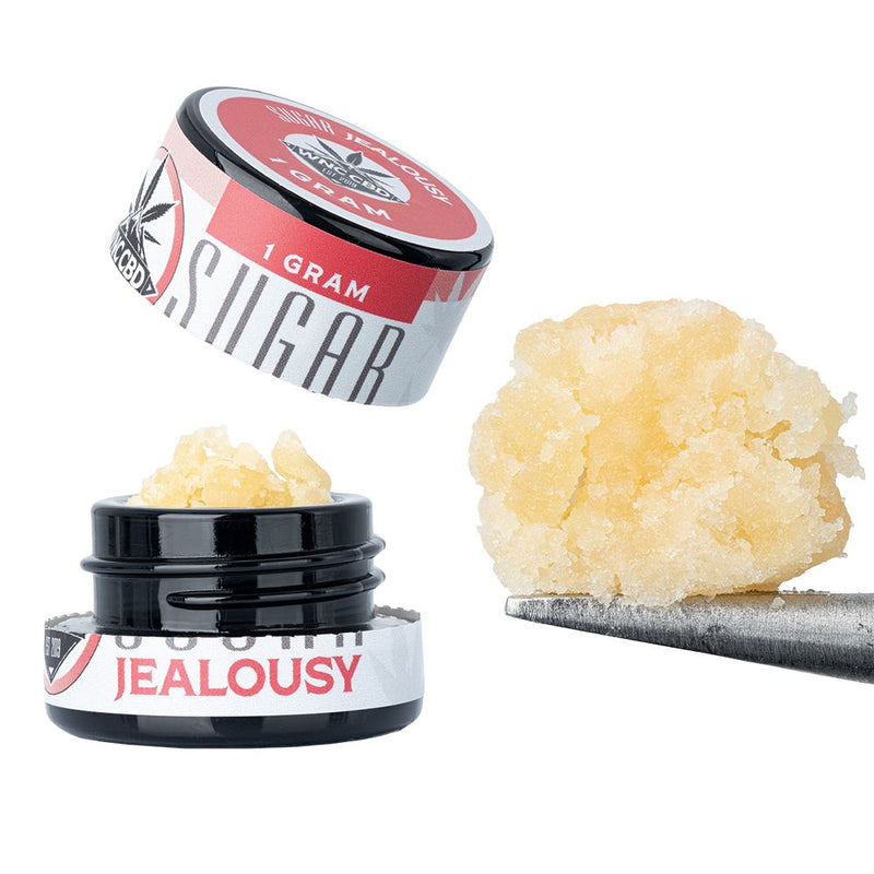 WNC CBD THCA Sugar in a black jar with a lid open, showcasing the golden sugar texture, 1 gram product size.
