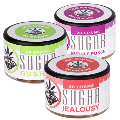 WNC CBD THCA Sugar products in jars including Gusher, Purple Punch, and Jealousy flavors, each 28 grams.
