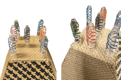 Colorful 2.5" double helix chillum hand pipes showcased on a natural fiber surface, highlighting their cute and fun design.