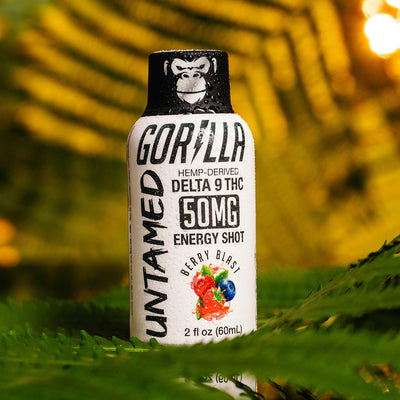 THC Energy Drink Shots - UNTAMED 50MG in berry blast flavor, featuring a gorilla design on the bottle, set against a vibrant background.